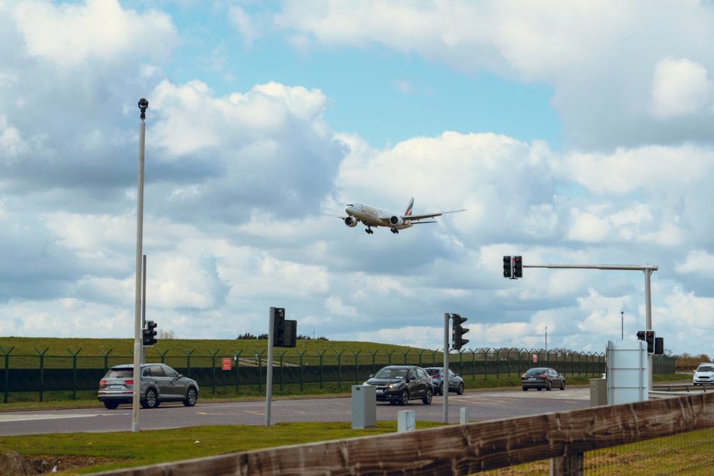 commercial-airplane-landing-amidst-traffic-and-clouds-31178390